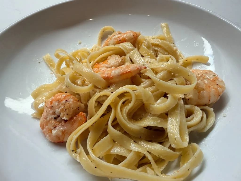 Creamy Shrimp Pasta — Fettuccine tossed in a quick butter and cream sauce with peppered shrimp and parsley. One skillet, abo…